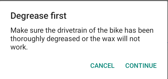A dialog headed Degrease first, warning that the drivetrain must be thoroughly degreased or the wax will not work, with Cancel and Continue.